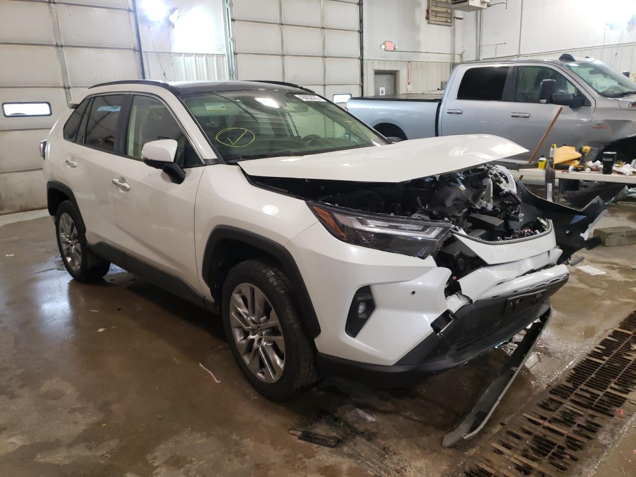 TOYOTA RAV4 LTD 2022 with VIN JTMN1RFV1ND086011 - Photo from auction