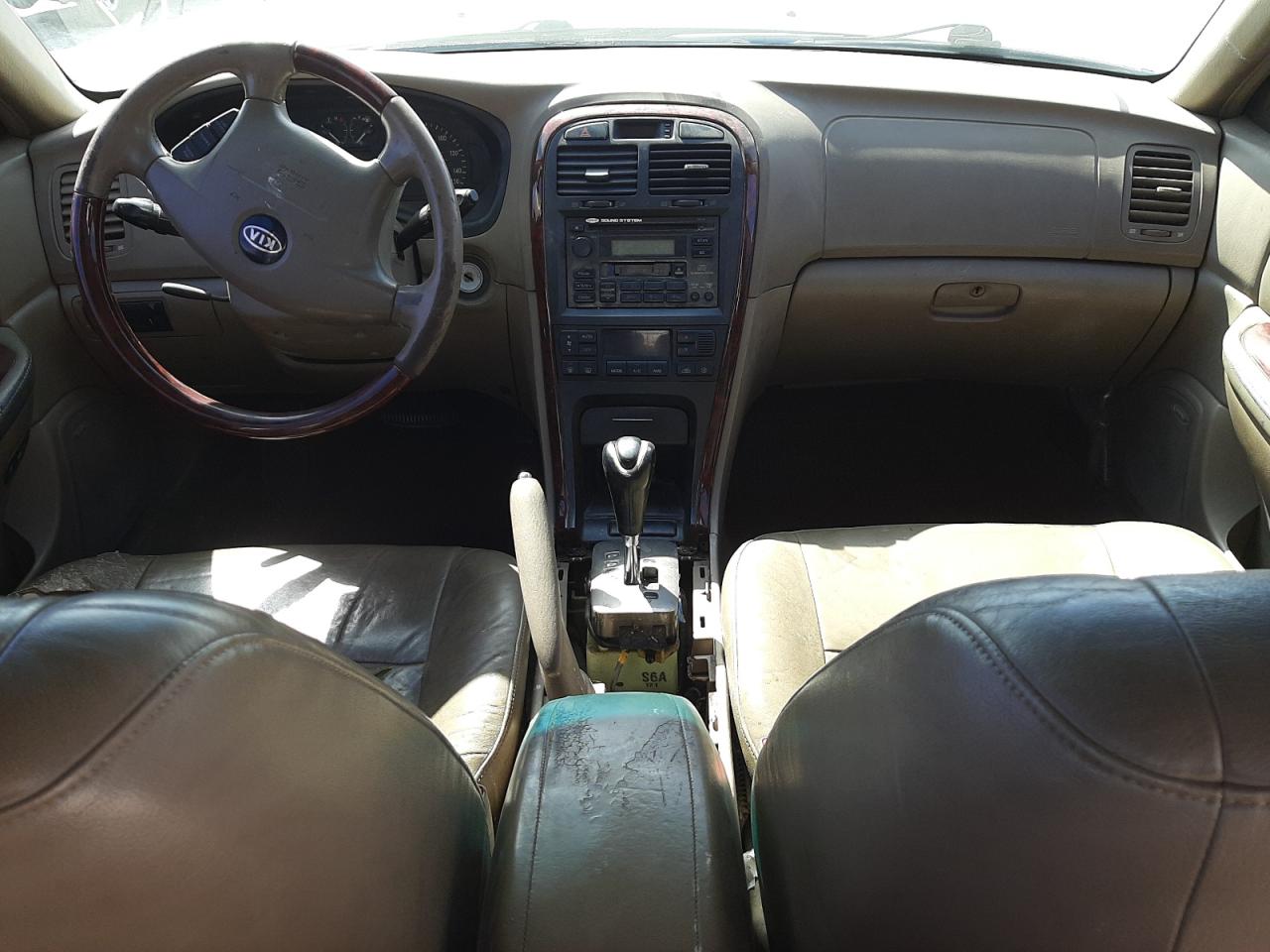 Photo 9 from auction – 2004 KIA OPTIMA LX with VIN KNAGD128245266119