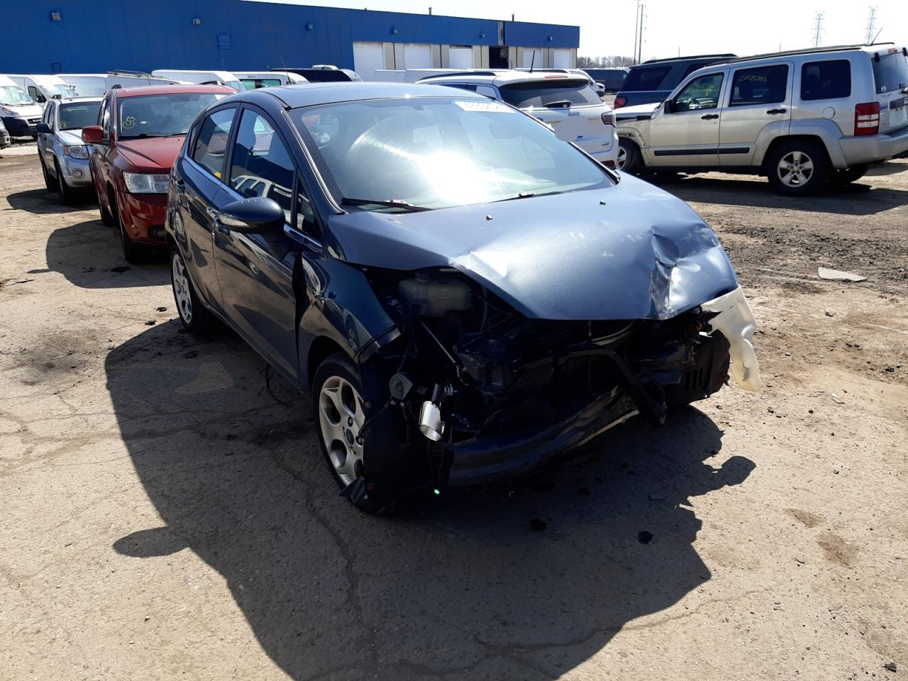 FORD FIESTA SES 2011 with VIN 3FADP4FJ1BM124840 - Photo from auction