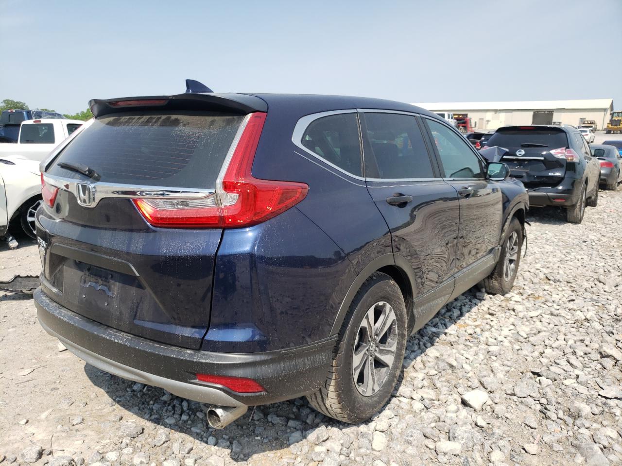 Photo 4 from auction – 2017 HONDA CR-V LX with VIN 7FARW5H37HE006851