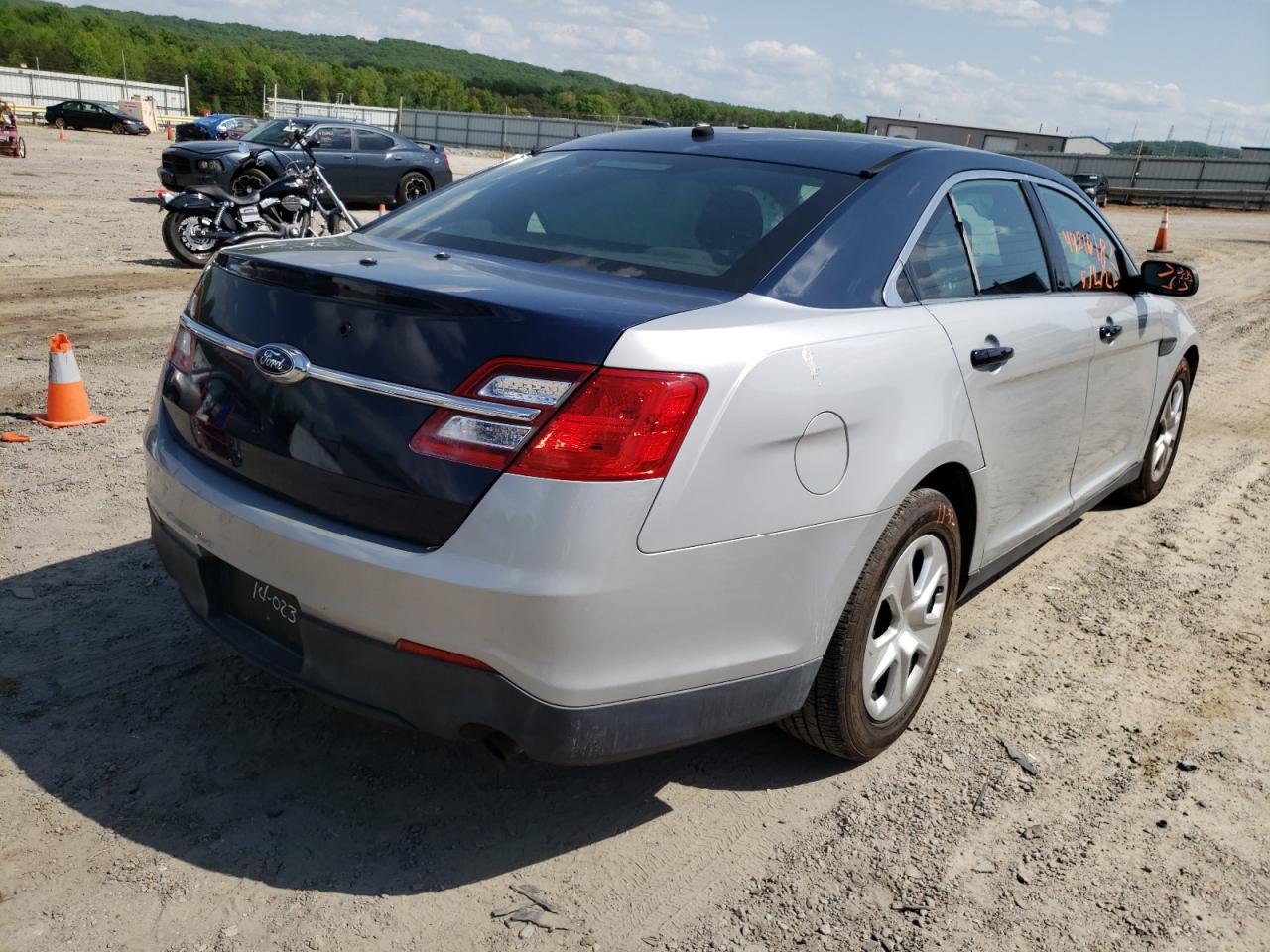 Photo 4 from auction – 2014 FORD TAURUS POL with VIN 1FAHP2MK4EG153703