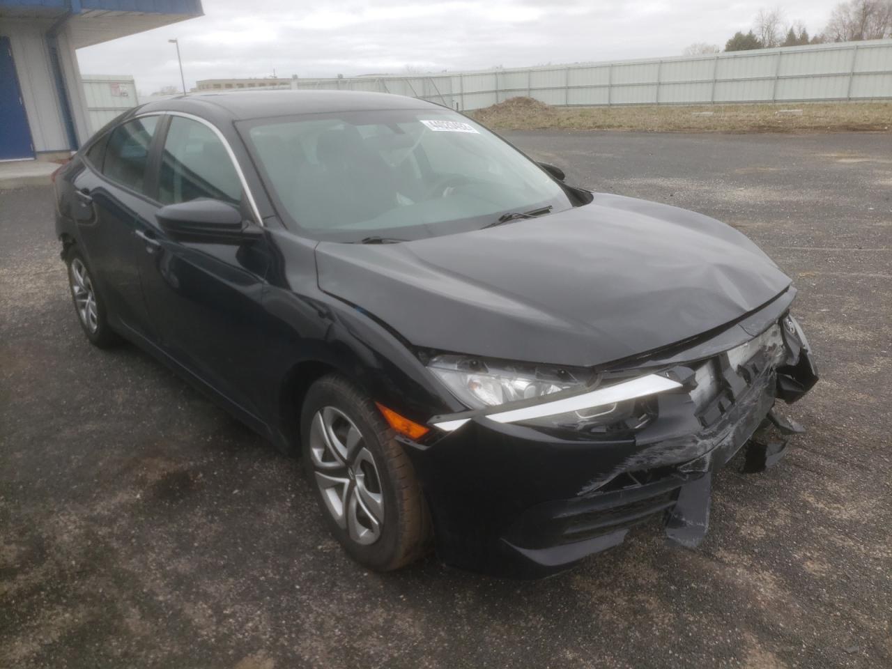 HONDA CIVIC LX 2018 with VIN 19XFC2F58JE015628 - Photo from auction