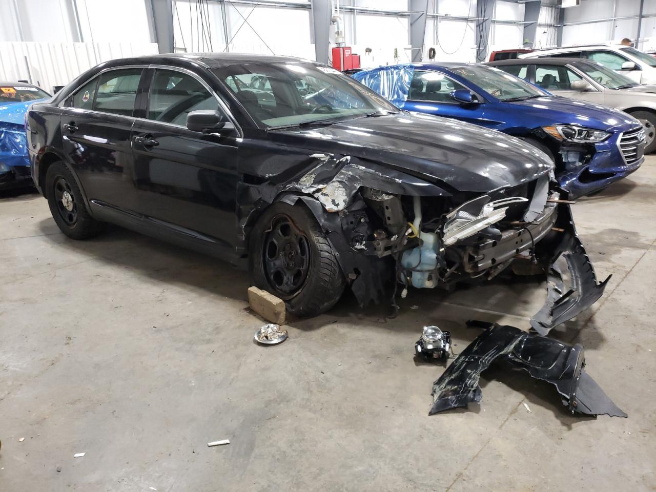 FORD TAURUS POL 2013 with VIN 1FAHP2M8XDG157760 - Photo from auction