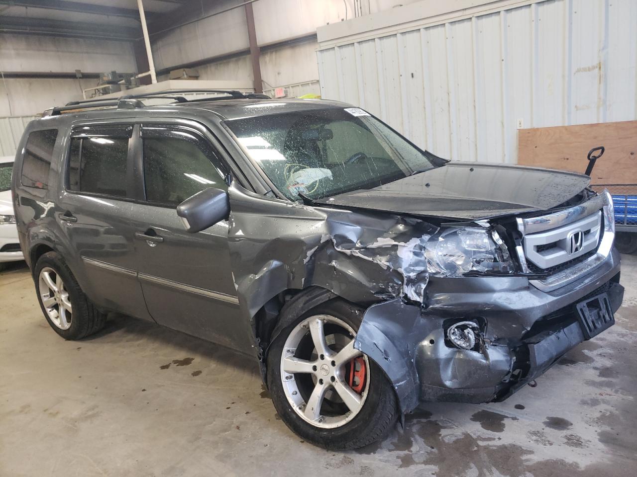 HONDA PILOT TOUR 2010 with VIN 5FNYF4H99AB024571 - Photo from auction