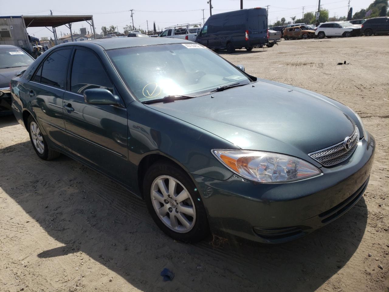 TOYOTA CAMRY LE 2002 with VIN JTDBF30KX20010239 - Photo from auction