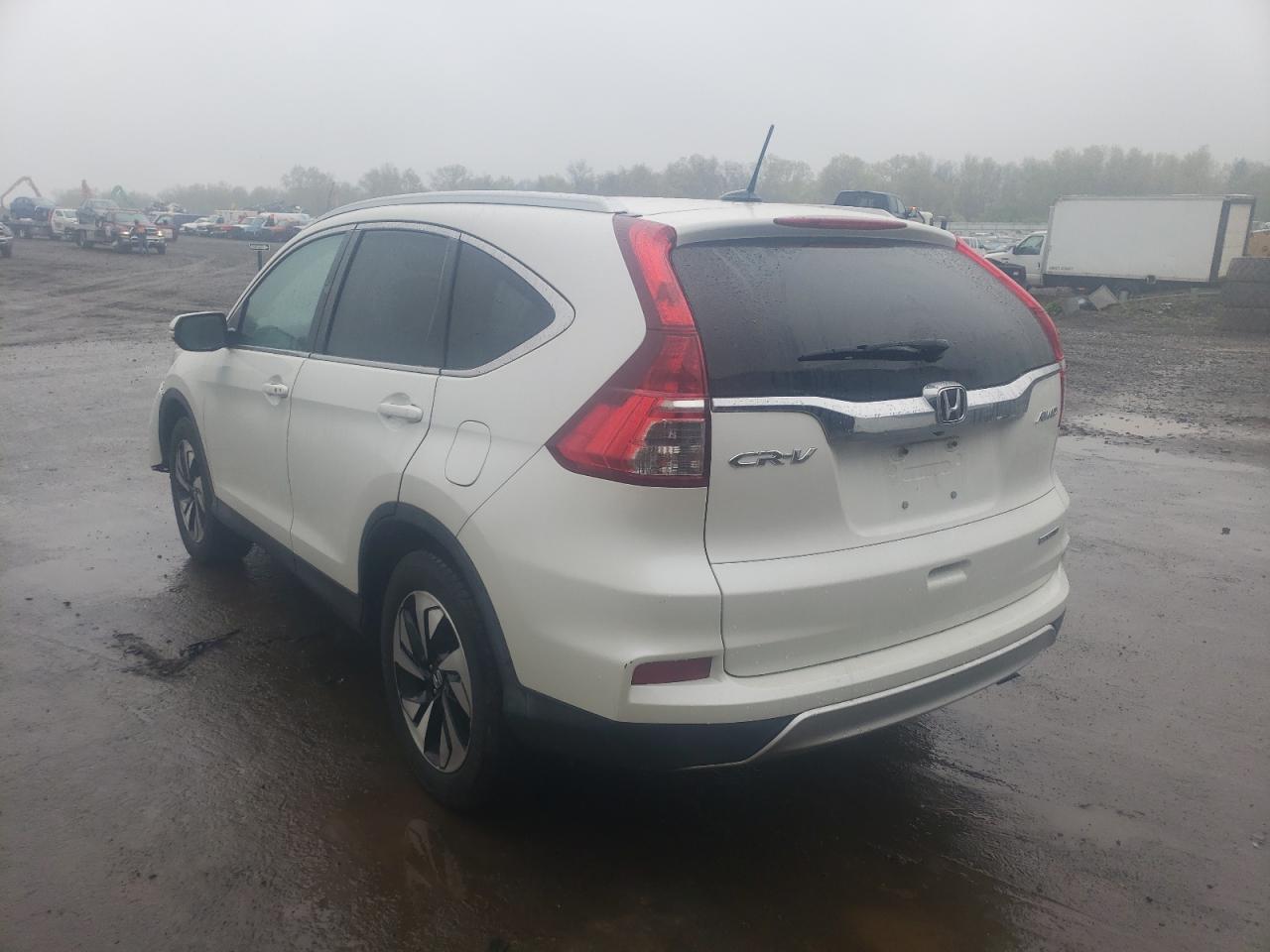 Photo 12 from auction – 2016 HONDA CR-V TOURI with VIN 5J6RM4H90GL093983