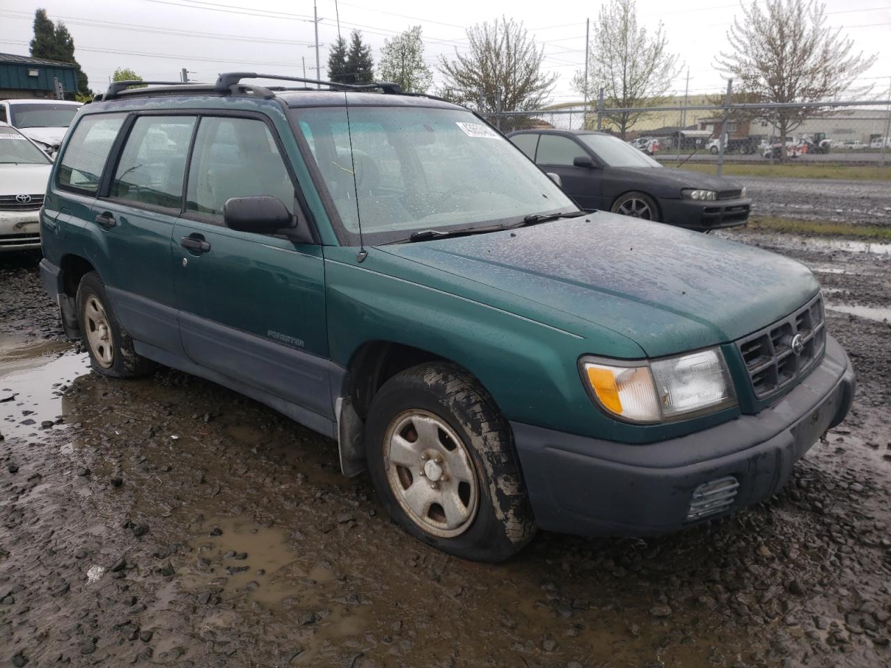 SUBARU FORESTER 1999 with VIN JF1SF6359XG738677 - Photo from auction