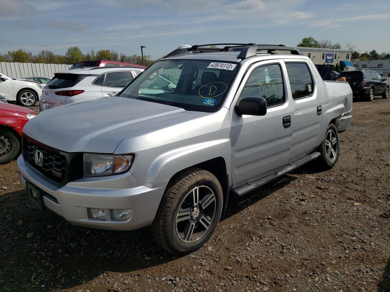 Photo 2 from auction – 2013 HONDA RIDGELINE with VIN 5FPYK1F76DB011462