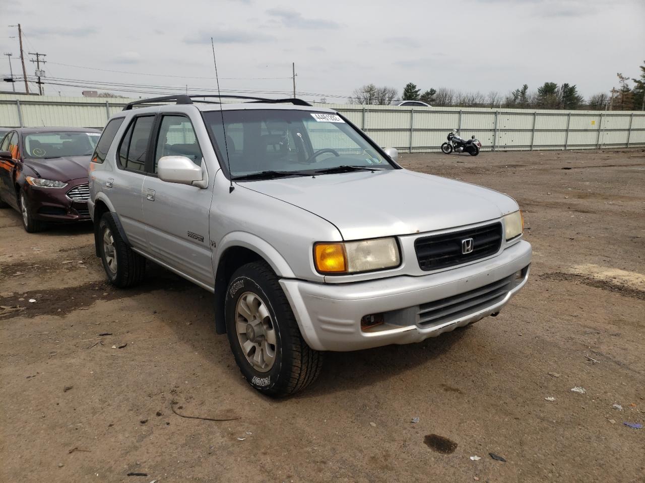 HONDA PASSPORT E 1999 مع رقم تعريف المركبة 4S6CM58W2X4423904 - صورة من المزاد