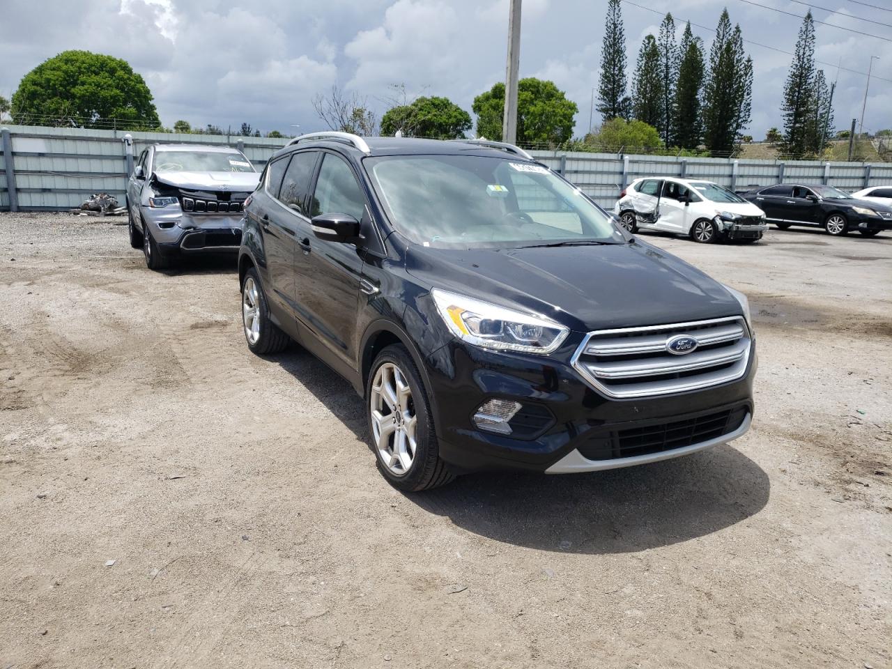 Photo 1 from auction – 2019 FORD ESCAPE TIT with VIN 1FMCU9J98KUB77499
