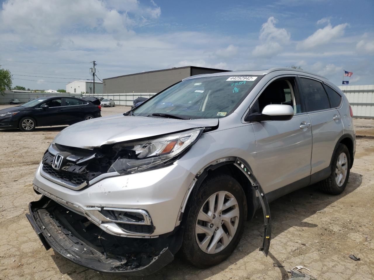 Photo 2 from auction – 2015 HONDA CR-V EXL with VIN 2HKRM4H79FH667889