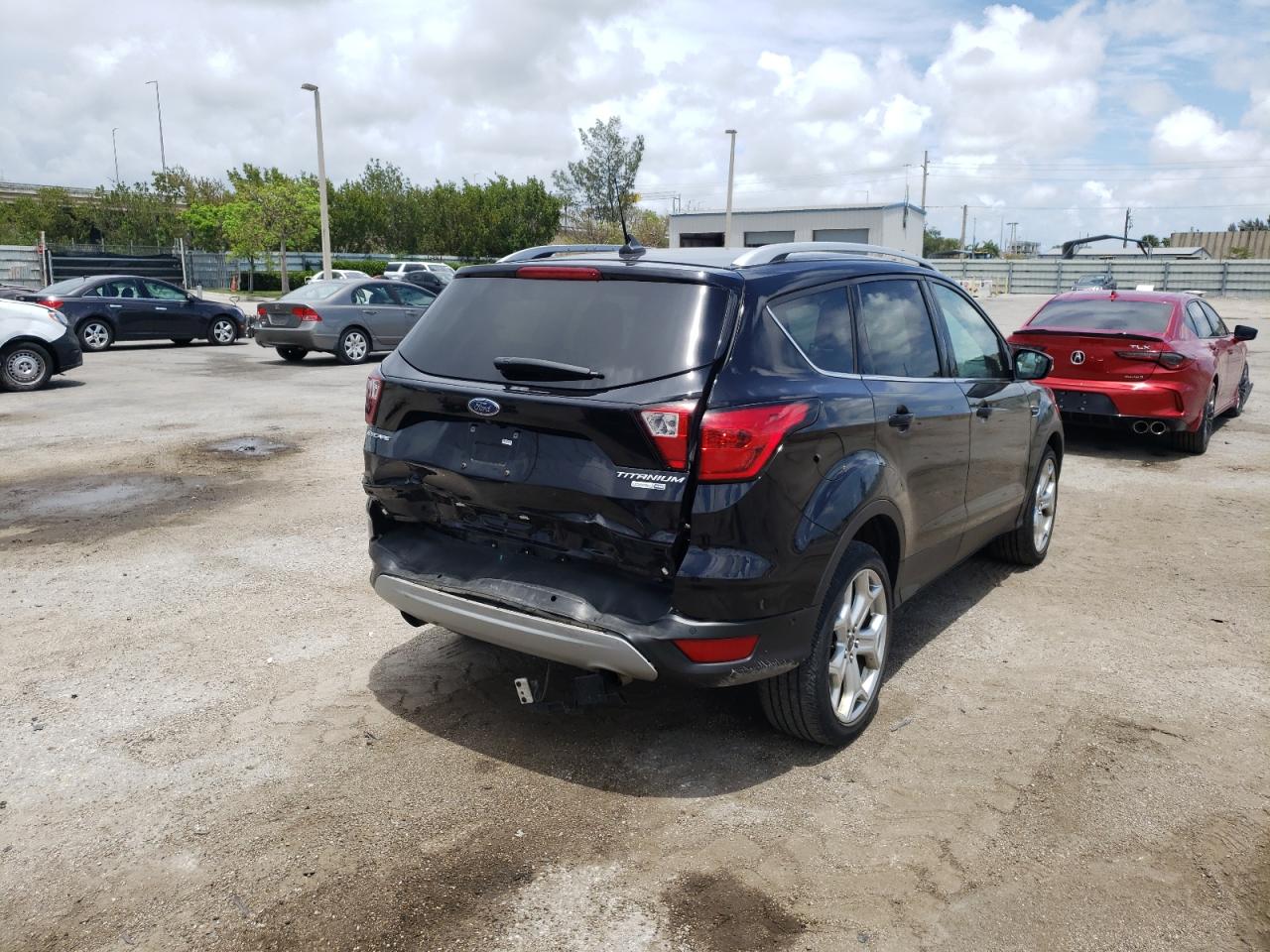 Photo 4 from auction – 2019 FORD ESCAPE TIT with VIN 1FMCU9J98KUB77499