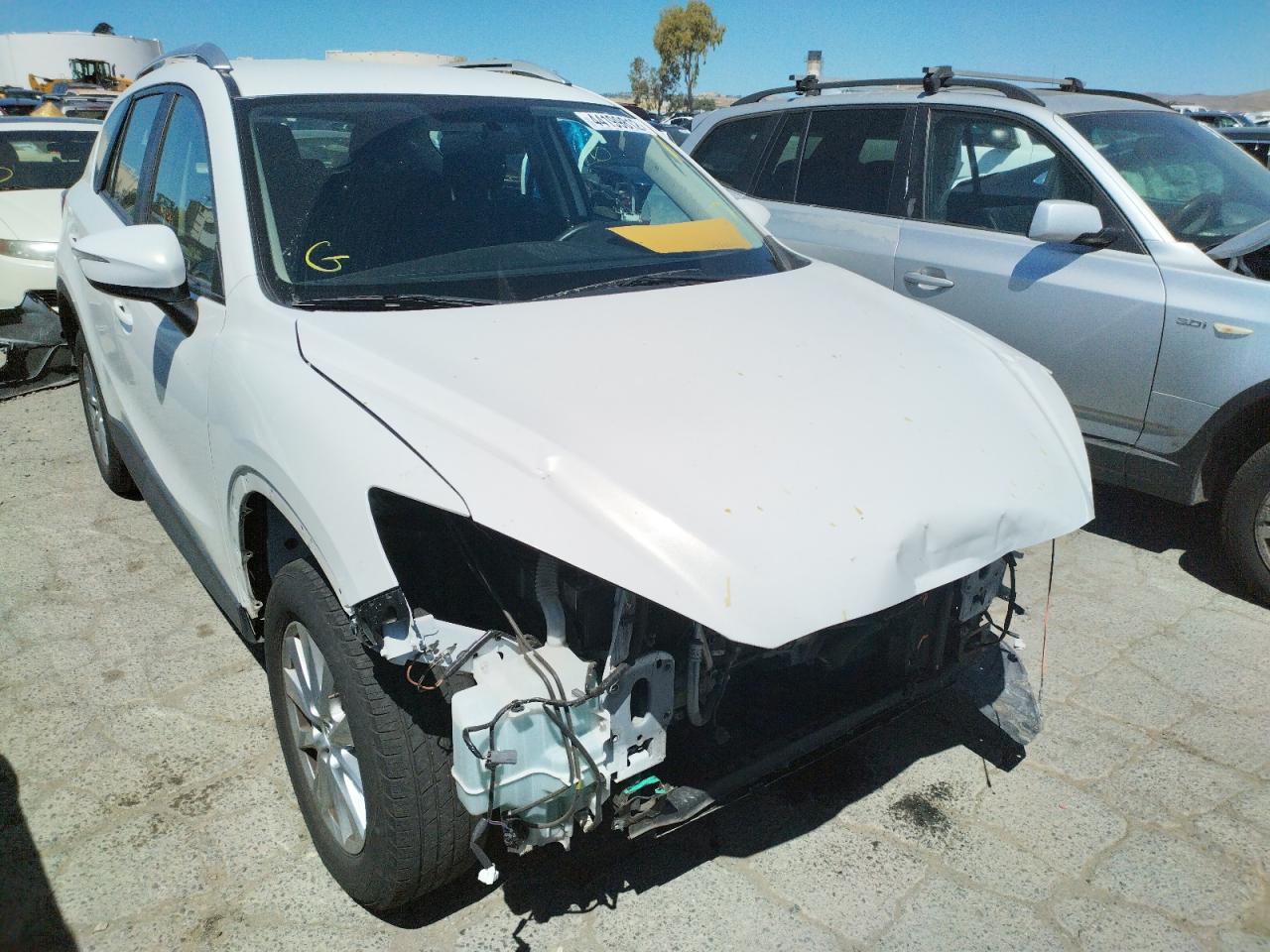 MAZDA CX-5 SPORT 2015 with VIN JM3KE2BE9F0480909 - Photo from auction