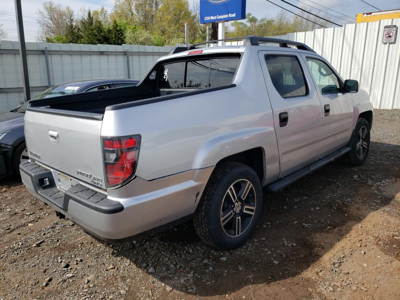 Photo 4 from auction – 2013 HONDA RIDGELINE with VIN 5FPYK1F76DB011462