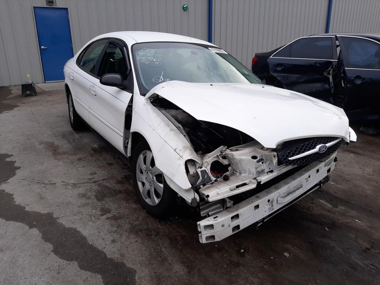 FORD TAURUS LX 2003 with VIN 1FAFP52U33A137554 - Photo from auction