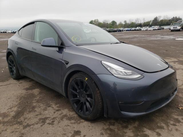 TESLA MODEL Y 2021 with VIN 5YJYGAEE0MF194206 - Photo from auction