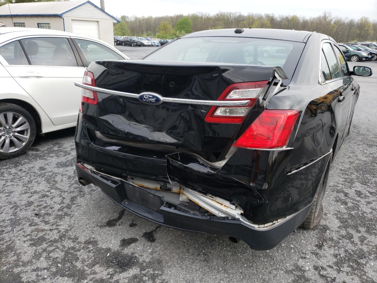 Photo 9 from auction – 2013 FORD TAURUS POL with VIN 1FAHP2MK8DG202027