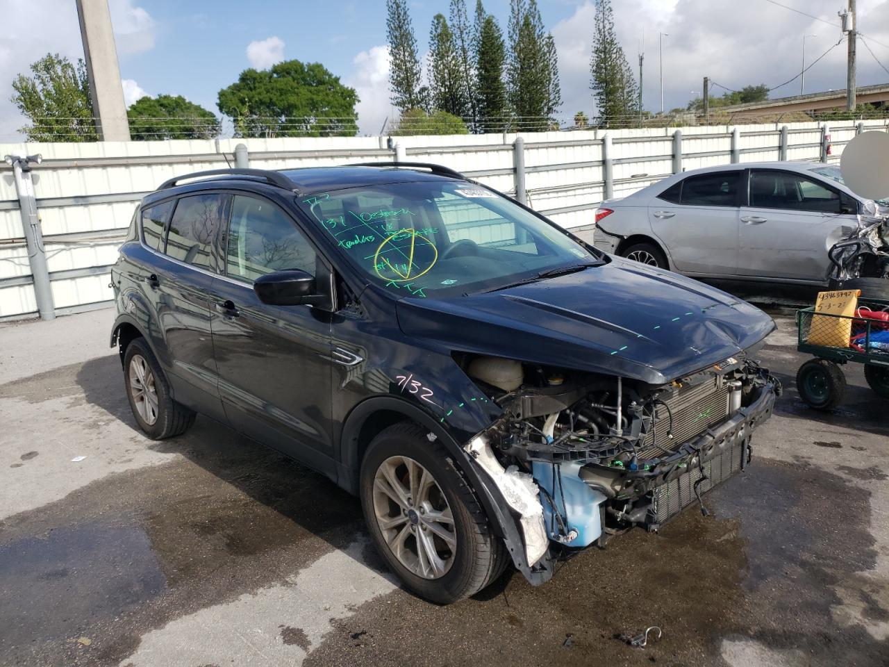 FORD ESCAPE SE 2018 with VIN 1FMCU9GD0JUA15182 - Photo from auction