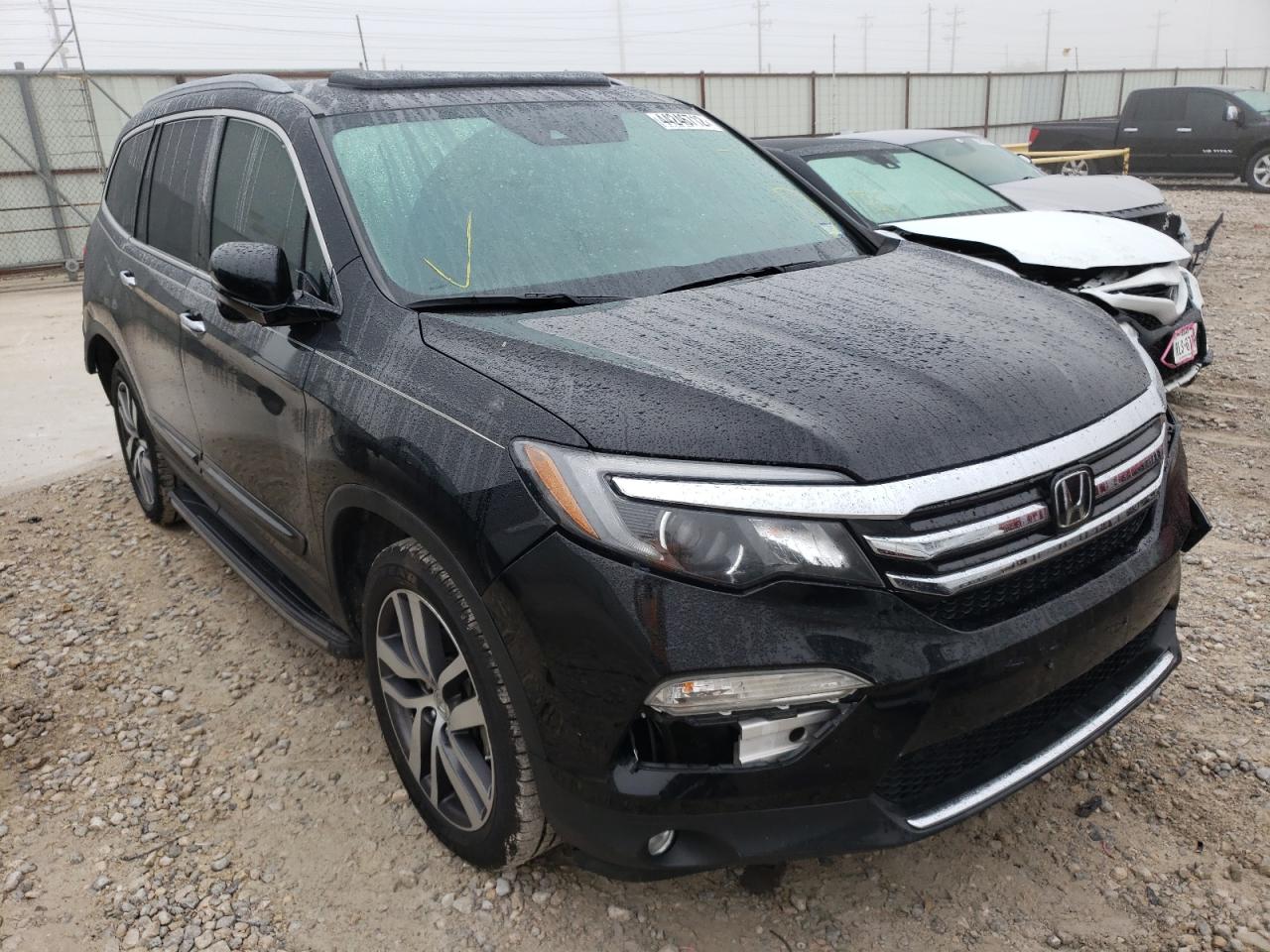 HONDA PILOT TOUR 2016 with VIN 5FNYF5H96GB060300 - Photo from auction