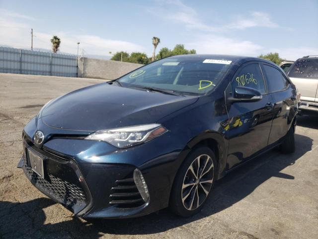 Photo 2 from auction – 2017 TOYOTA COROLLA L with VIN 5YFBURHE0HP696040
