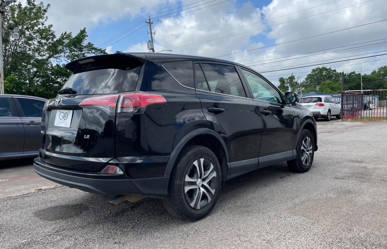Photo 4 from auction – 2018 TOYOTA RAV4 LE with VIN 2T3ZFREV2JW411122