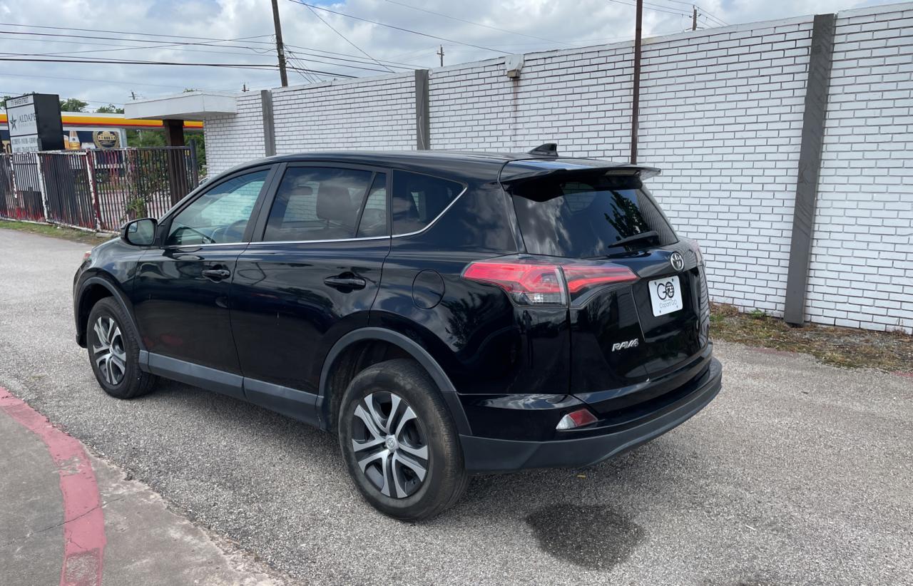 Photo 3 from auction – 2018 TOYOTA RAV4 LE with VIN 2T3ZFREV2JW411122