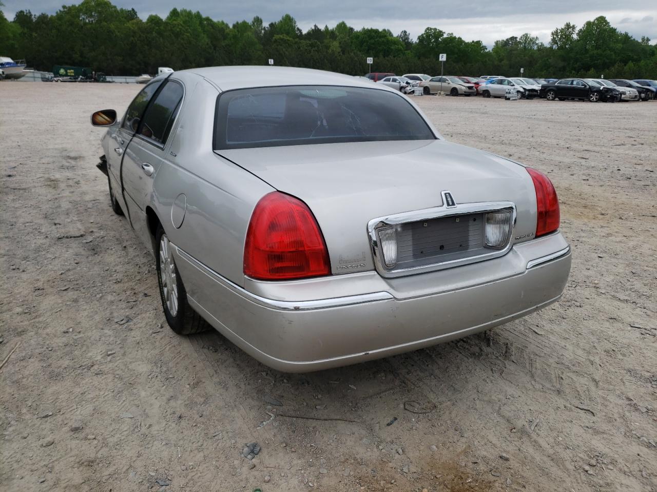 Photo 3 from auction – 2003 LINCOLN TOWN CAR E with VIN 1LNHM81W33Y694693