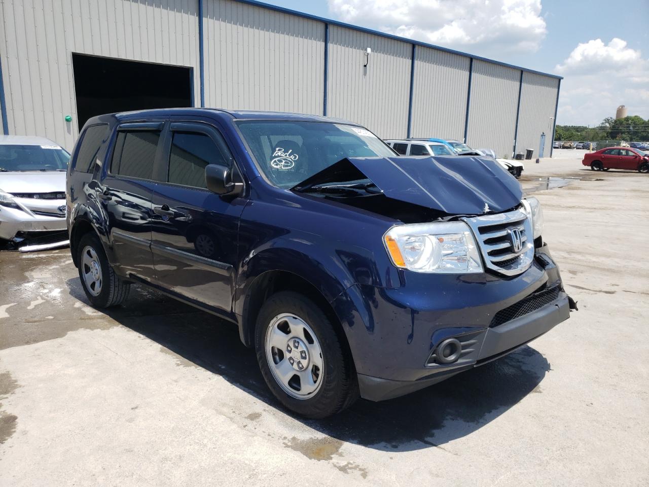 HONDA PILOT LX 2015 with VIN 5FNYF3H29FB027068 - Photo from auction