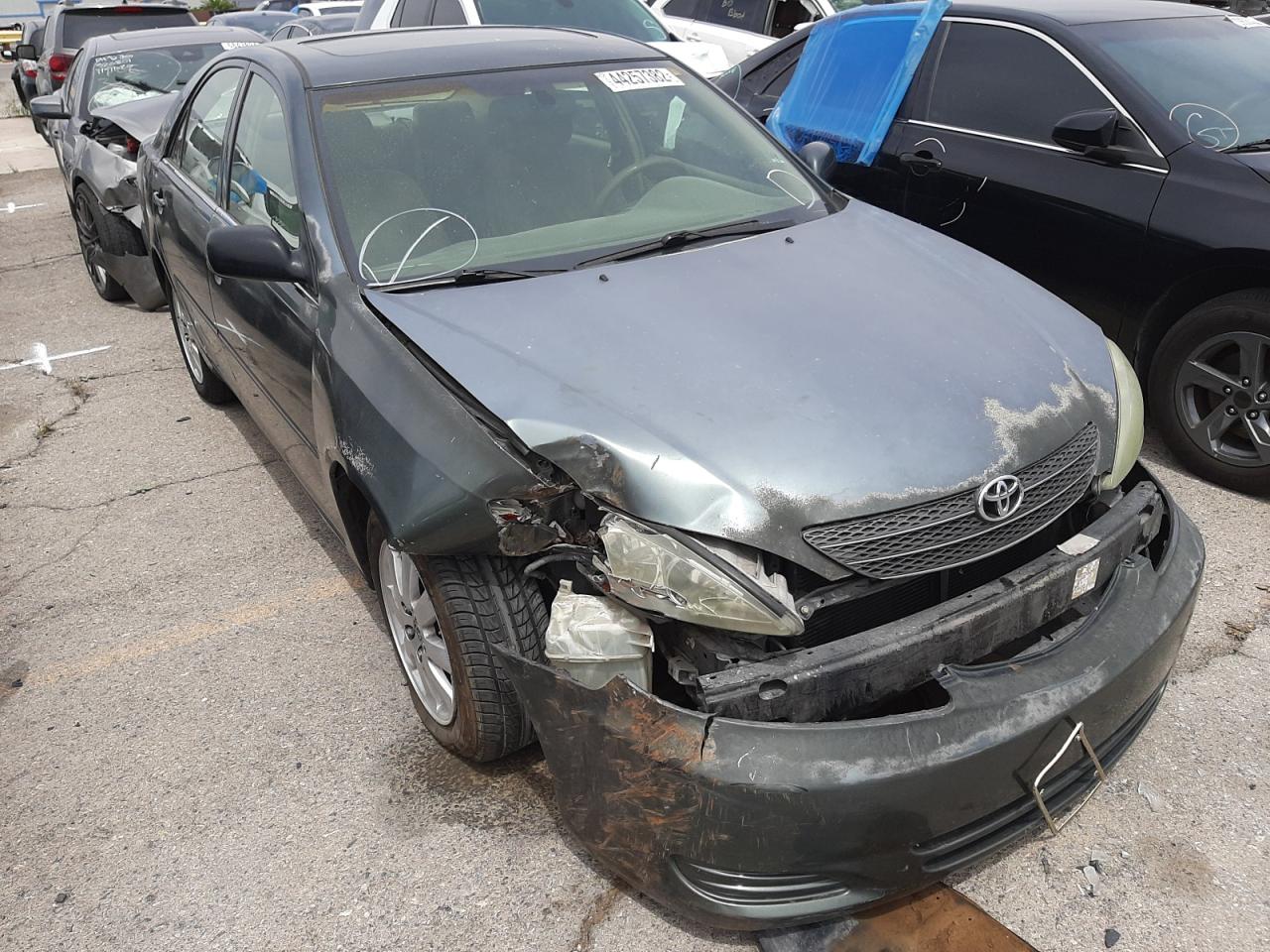 TOYOTA CAMRY LE 2002 with VIN 4T1BE30K32U593986 - Photo from auction