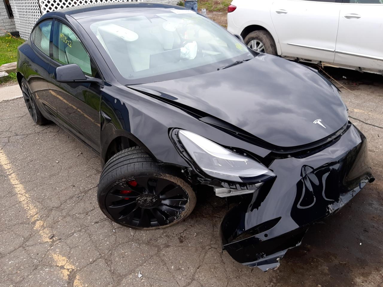 TESLA MODEL 3 2022 with VIN 5YJ3E1EC7NF203323 - Photo from auction