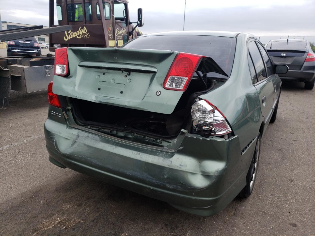 Photo 9 from auction – 2004 HONDA CIVIC DX with VIN 2HGES16454H613590