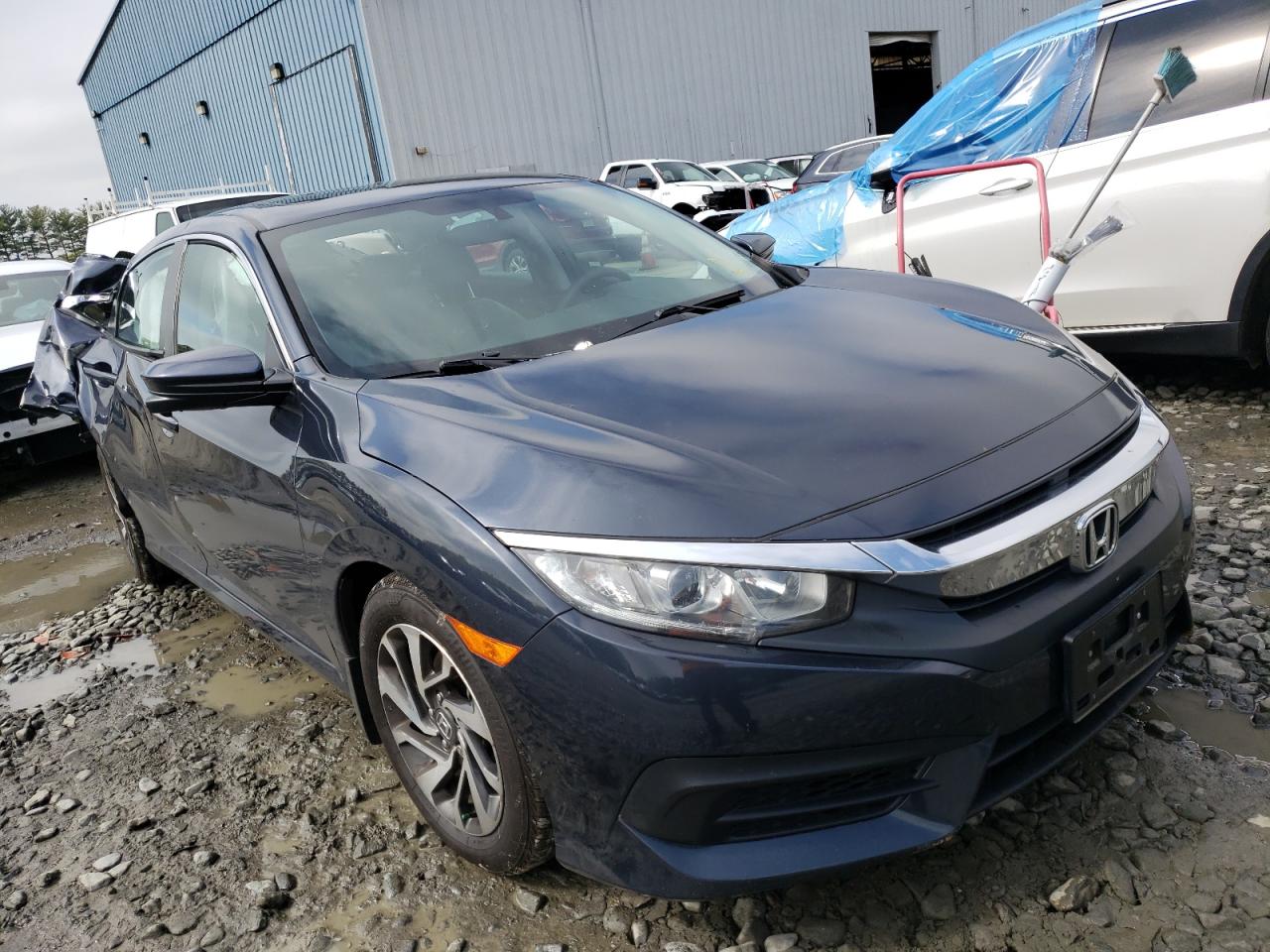 HONDA CIVIC EX 2017 with VIN 2HGFC2F73HH560511 - Photo from auction