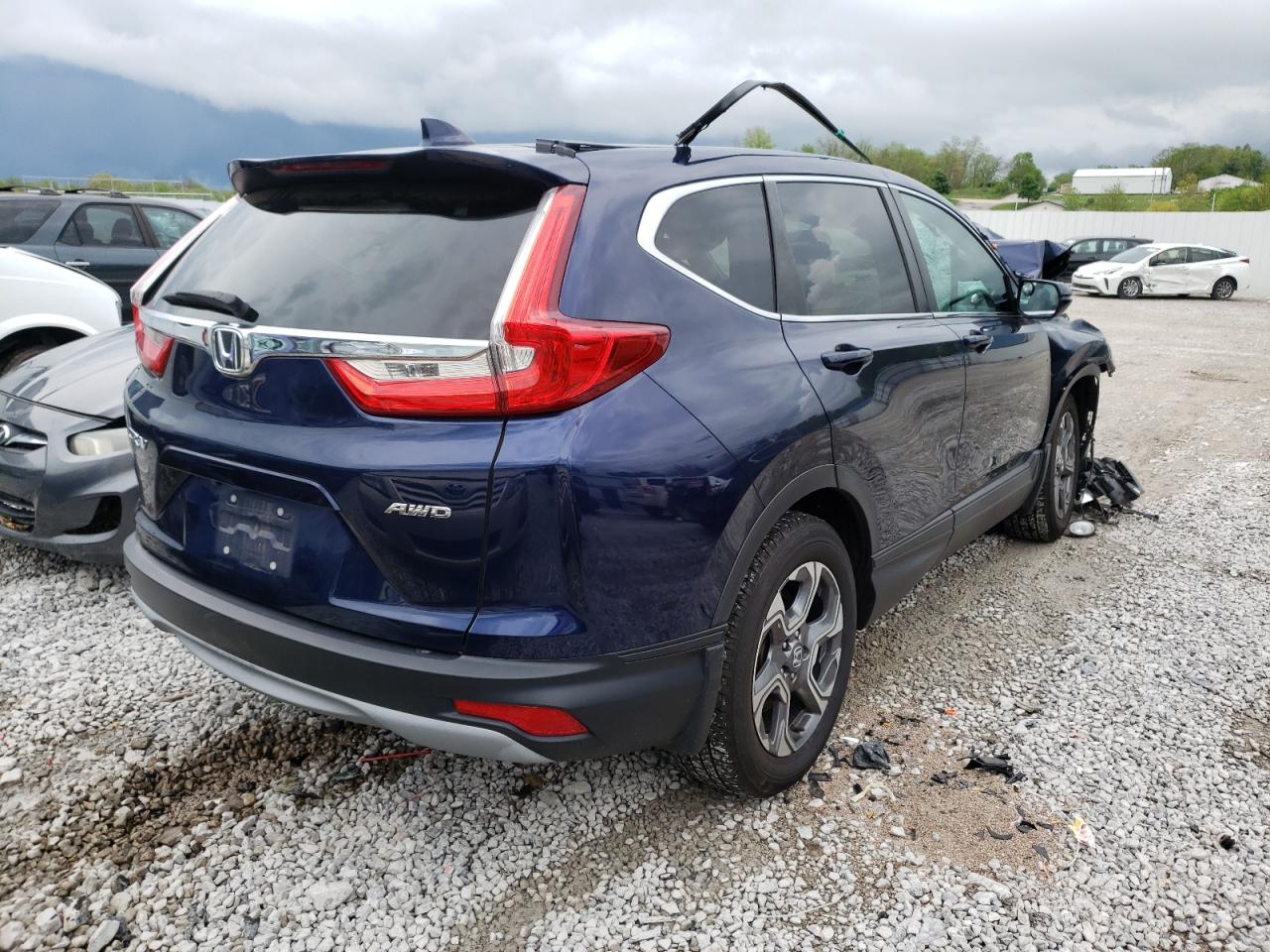 Photo 4 from auction – 2017 HONDA CR-V EXL with VIN 5J6RW2H85HL019496