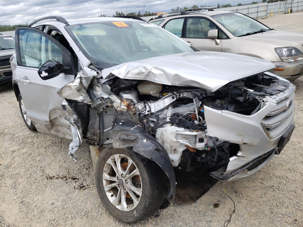 FORD ESCAPE SE 2018 with VIN 1FMCU0GD9JUC90156 - Photo from auction