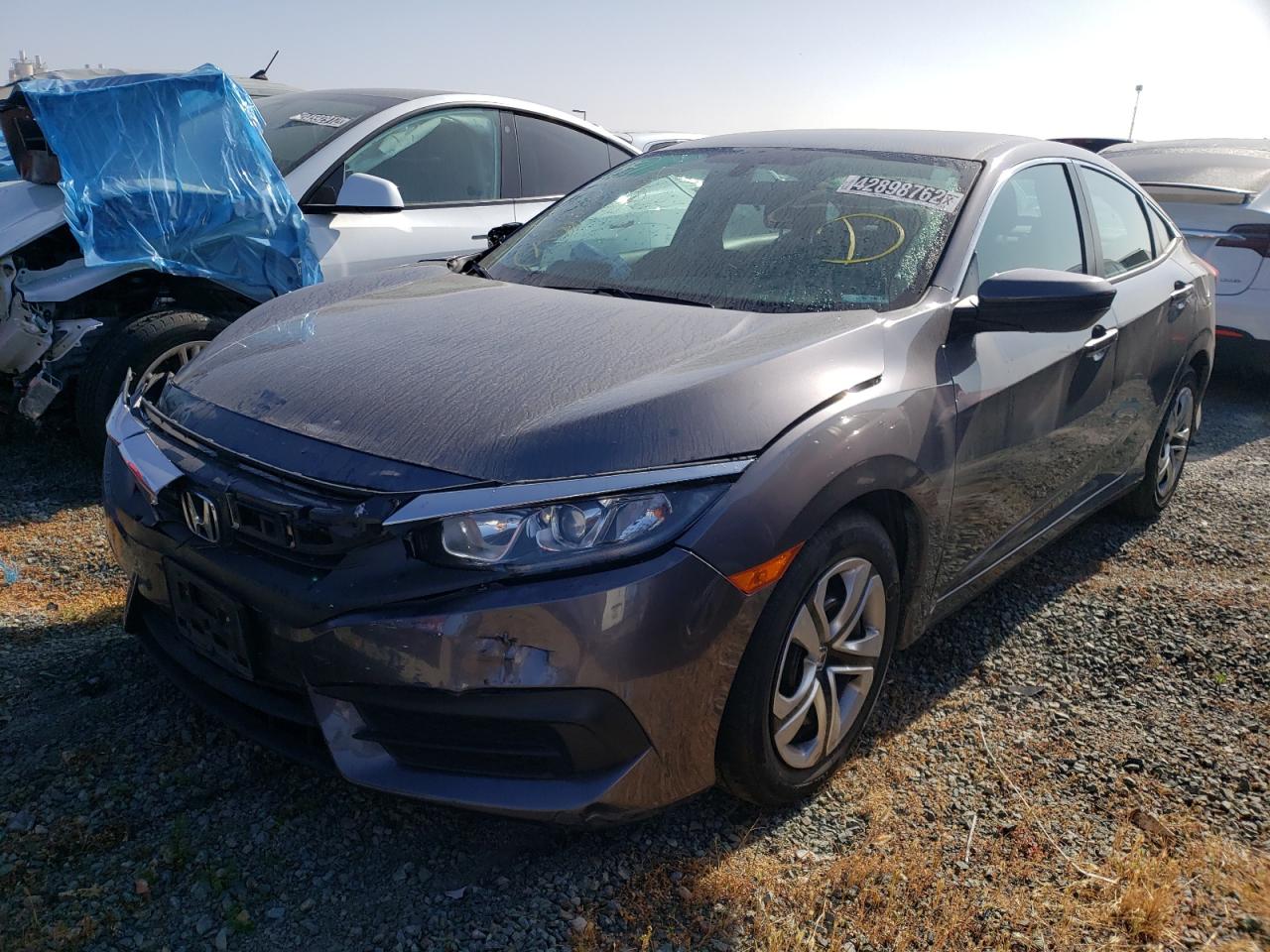 Photo 2 from auction – 2018 HONDA CIVIC LX with VIN 2HGFC2F57JH526222