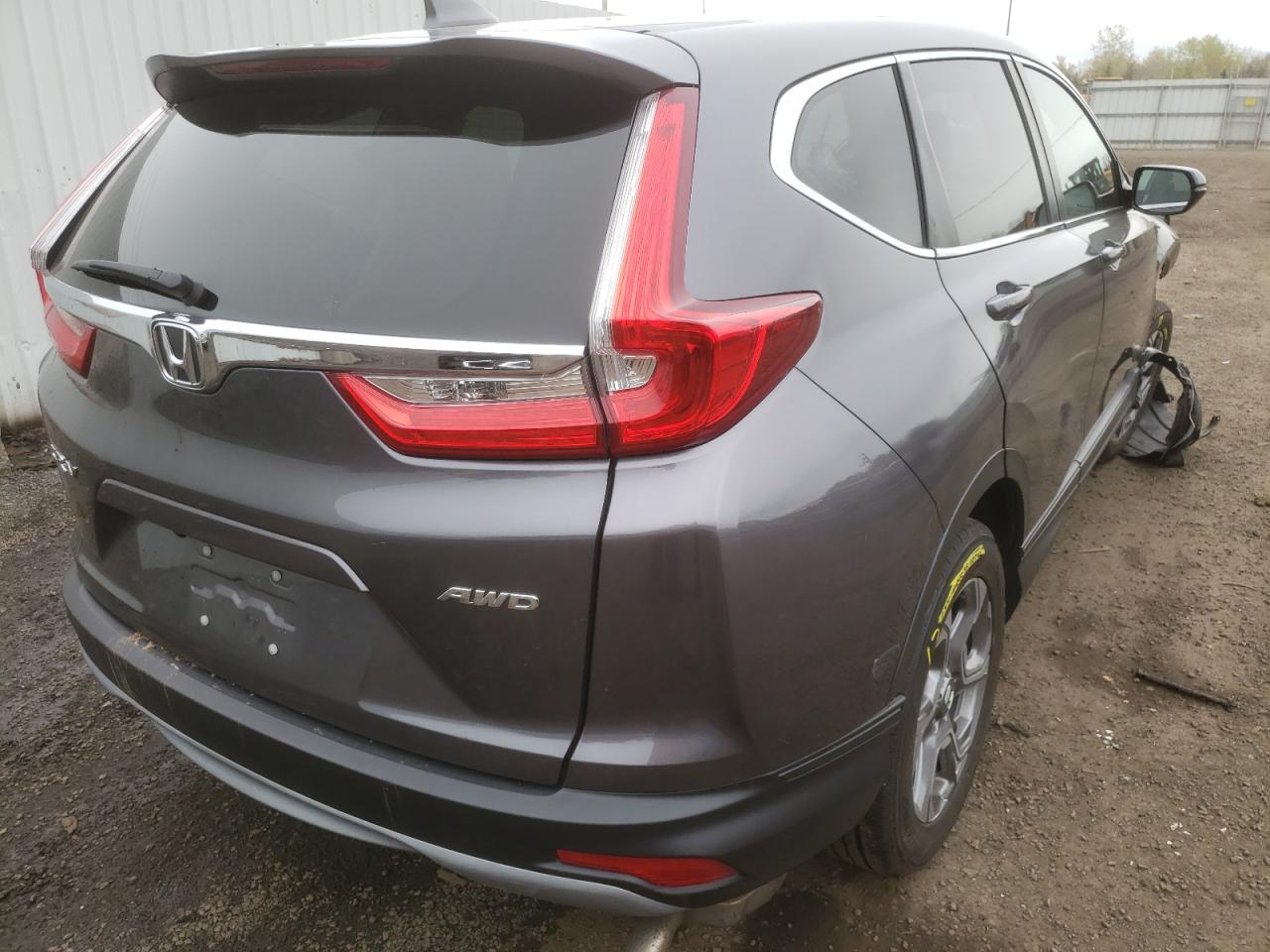Photo 14 from auction – 2018 HONDA CR-V EXL with VIN 2HKRW2H80JH628205