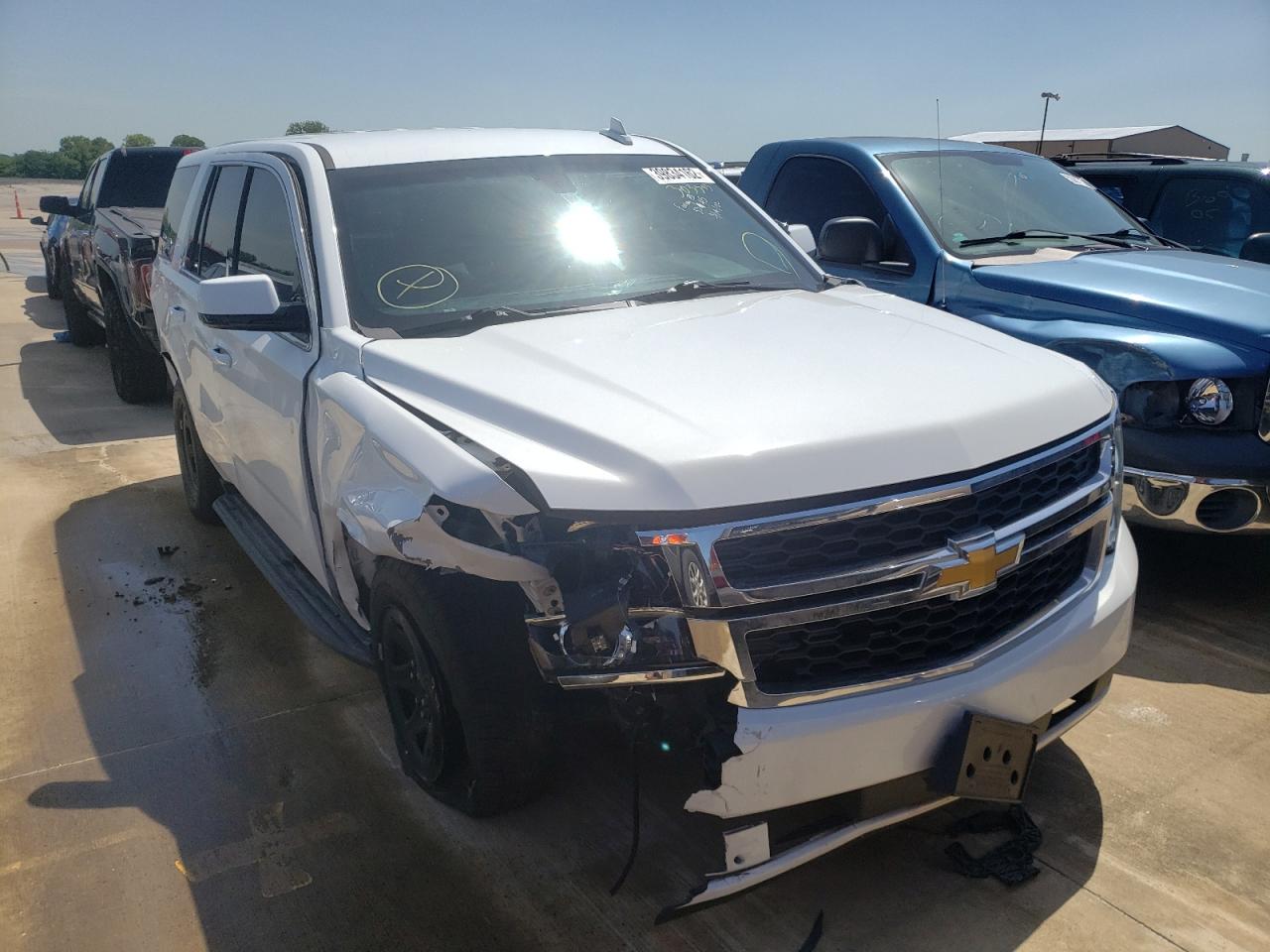 CHEVROLET TAHOE POLI 2019 with VIN 1GNLCDEC7KR303345 - Photo from auction