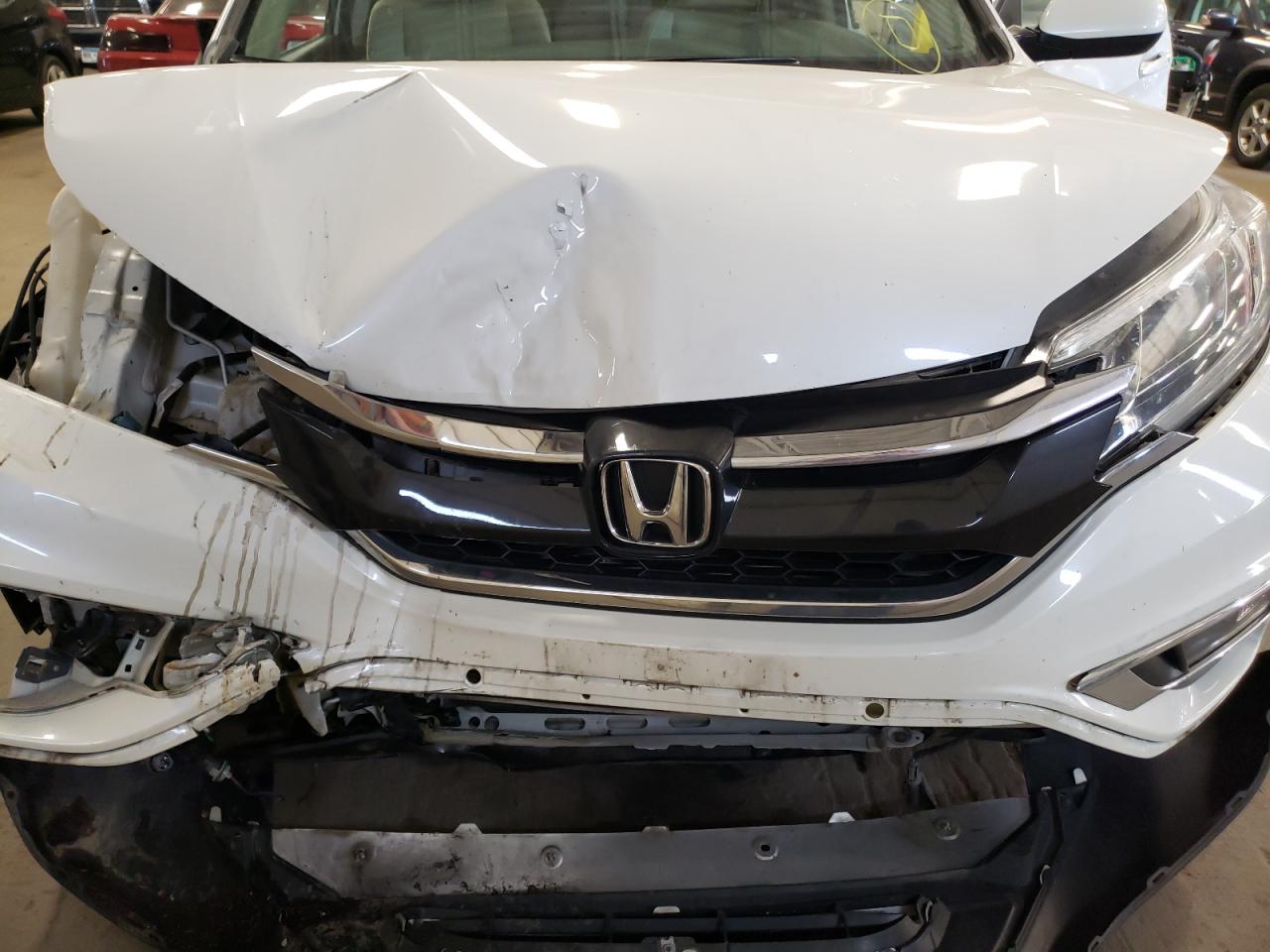 Photo 7 from auction – 2016 HONDA CR-V with VIN 5J6RM4H57GL125776