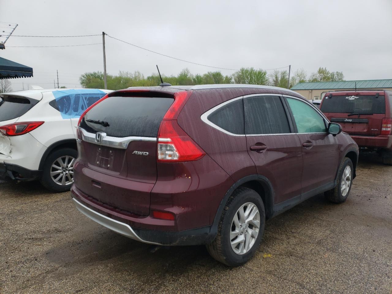 Photo 4 from auction – 2016 HONDA CR-V EXL with VIN 5J6RM4H76GL083120