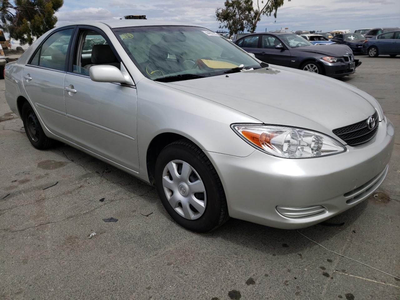 TOYOTA CAMRY LE 2003 with VIN JTDBE30KX30148898 - Photo from auction