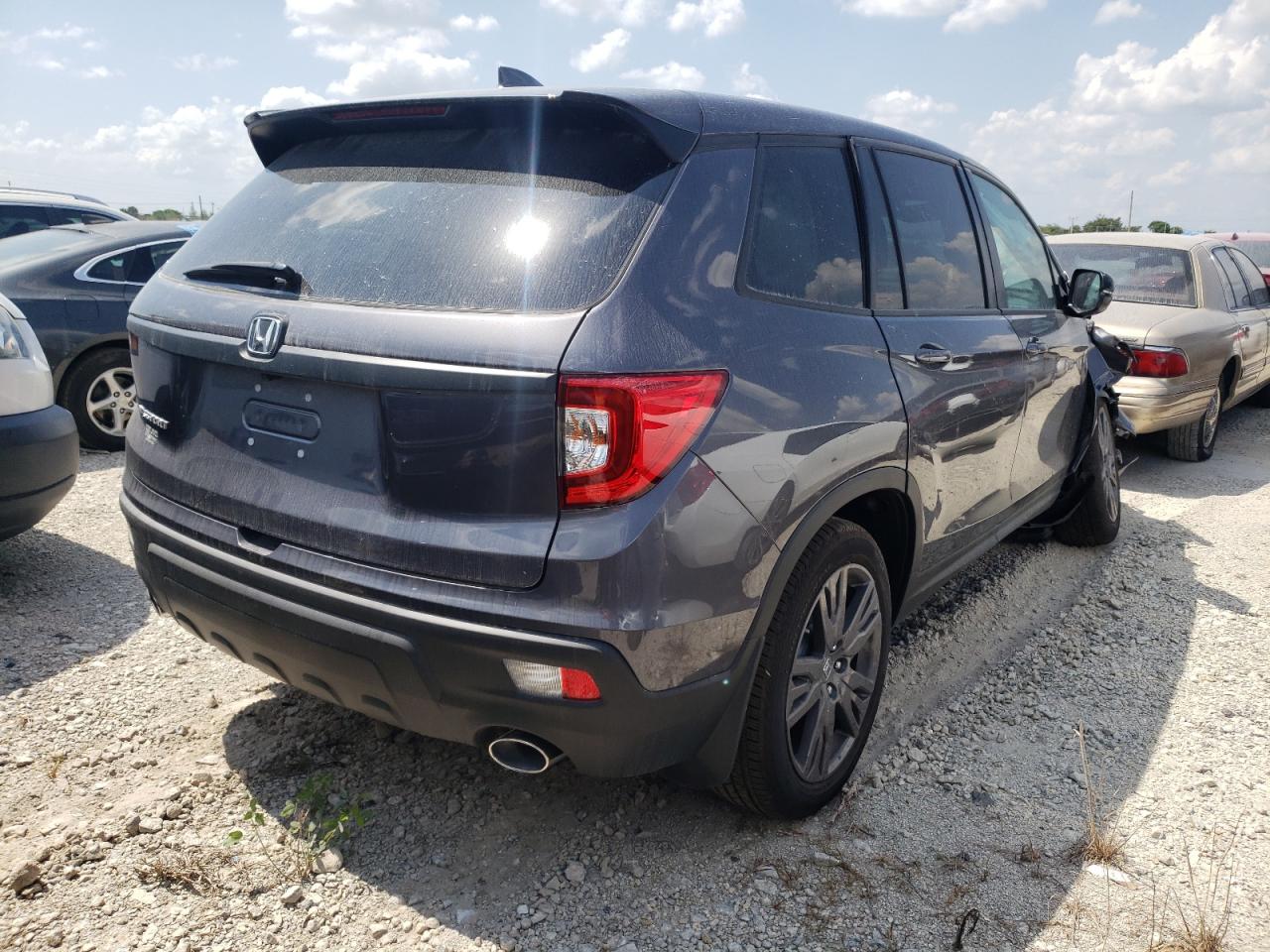 Photo 4 from auction – 2021 HONDA PASSPORT E with VIN 5FNYF7H5XMB013078