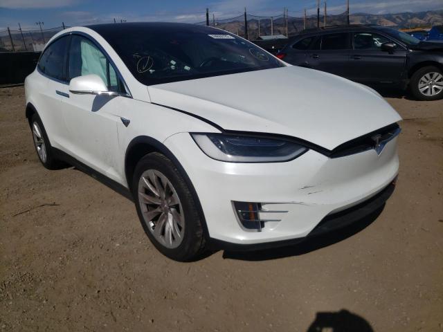 TESLA MODEL X 2018 with VIN 5YJXCAE25JF091551 - Photo from auction