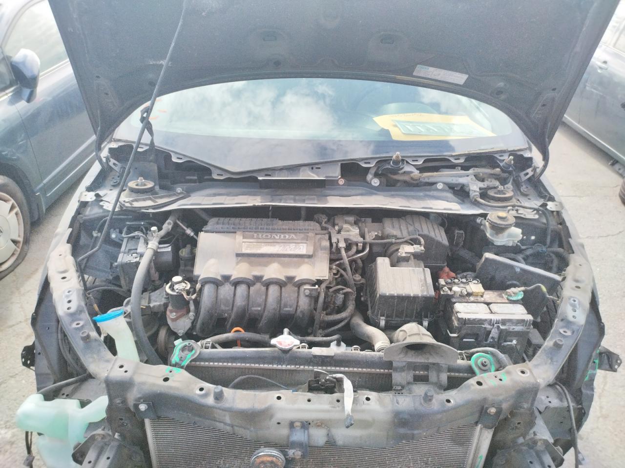 Photo 7 from auction – 2011 HONDA INSIGHT EX with VIN JHMZE2H70BS004609
