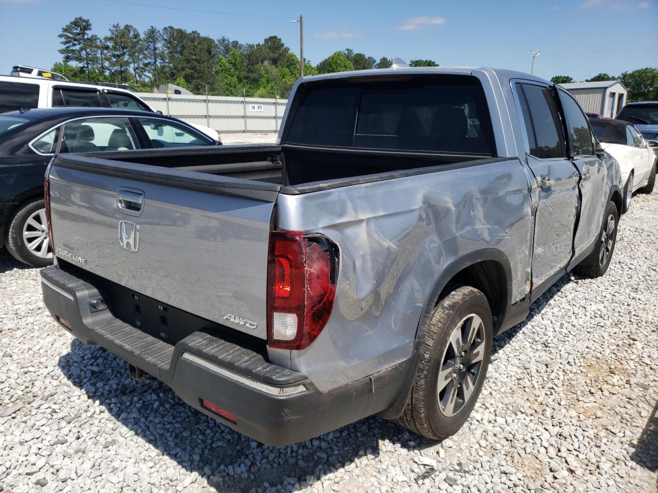 Photo 4 from auction – 2020 HONDA RIDGELINE with VIN 5FPYK3F57LB013245