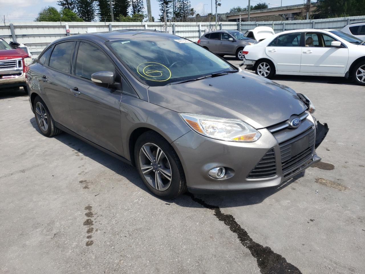 FORD FOCUS SE 2014 with VIN 1FADP3F23EL338656 - Photo from auction
