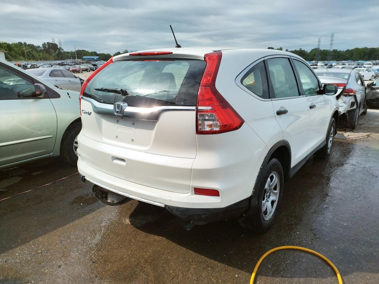 Photo 17 from auction – 2016 HONDA CR-V LX with VIN 5J6RM3H35GL017004