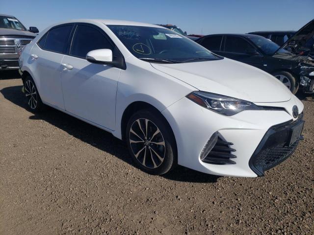 TOYOTA COROLLA L 2019 with VIN 5YFBURHE8KP878088 - Photo from auction