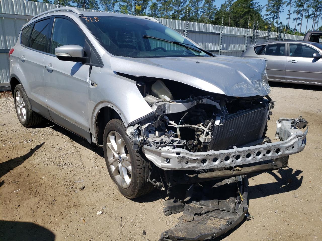 FORD ESCAPE TIT 2014 with VIN 1FMCU0JX2EUB17619 - Photo from auction