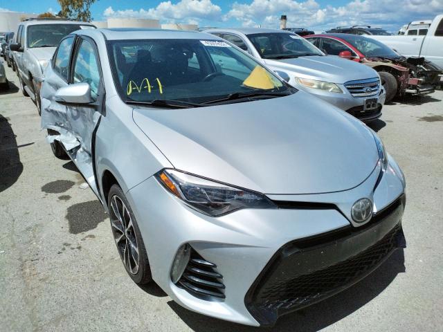 TOYOTA COROLLA L 2017 with VIN 5YFBURHE1HP628300 - Photo from auction