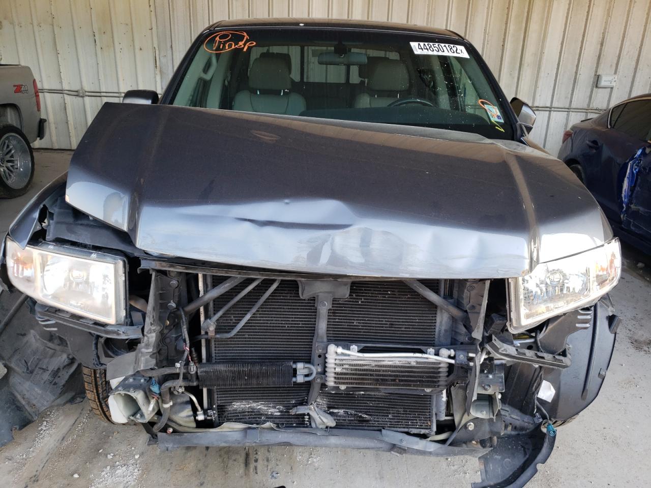 Photo 9 from auction – 2011 HONDA RIDGELINE with VIN 5FPYK1F55BB001050